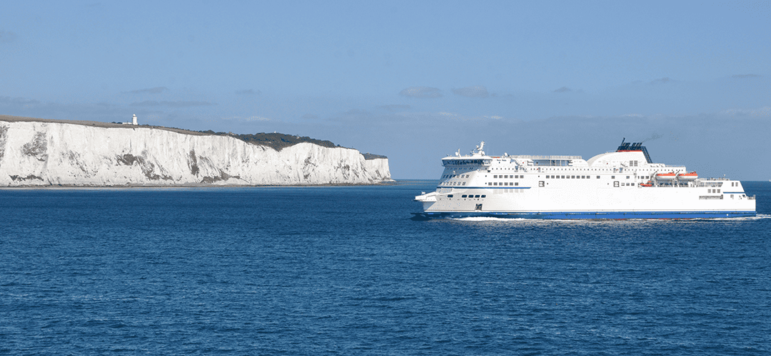 Car Ferry arriving at Dover UK with the wight cliffs of dover in the background